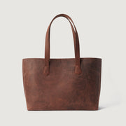 
The Bianca Vintage Distressed Brown Leather Tote Bag For Women - Perfil lateral estruturado com fole espaçoso